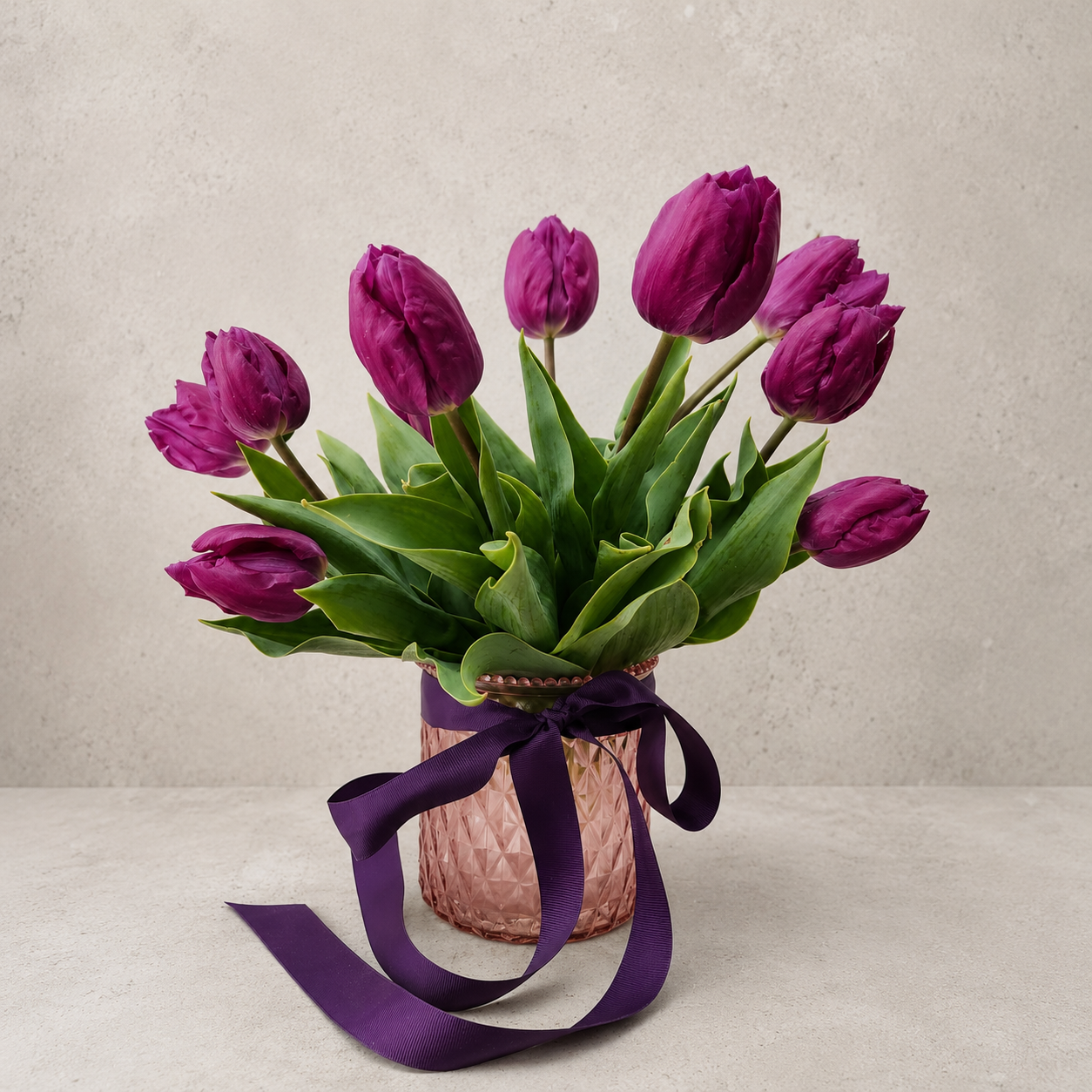 Five Acre Florets Tulip Vase — purple tulips in a pink faceted glass vase with a deep purple ribbon